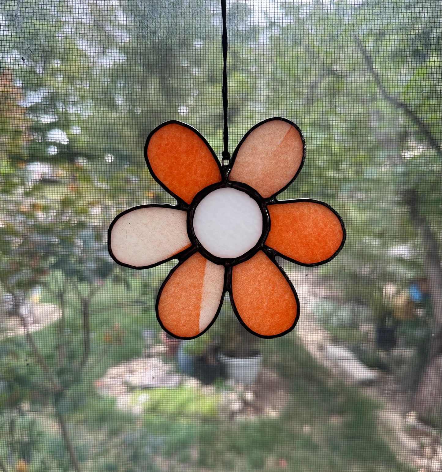 Orange and white glass flower