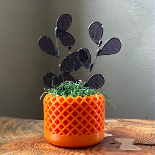 Orange 3D planter with three purple glass stems