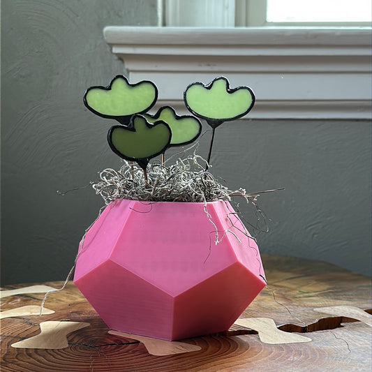 Pink 3D planter with four green glass stems