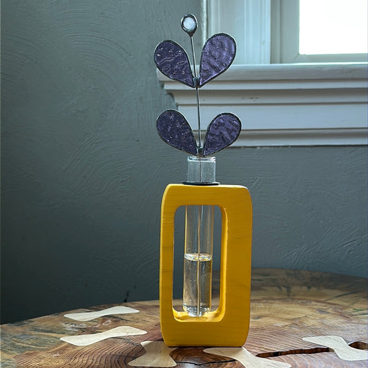 Yellow wooden propagation station with purple glass